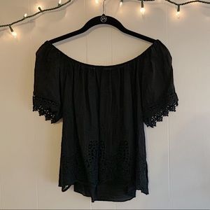 Black cotton and crocheted off the shoulder top